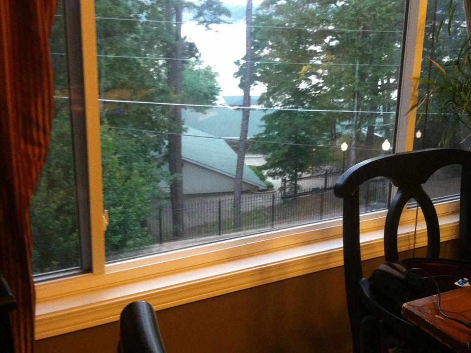3 large upstairs Picture windows overlooking lake, sky and