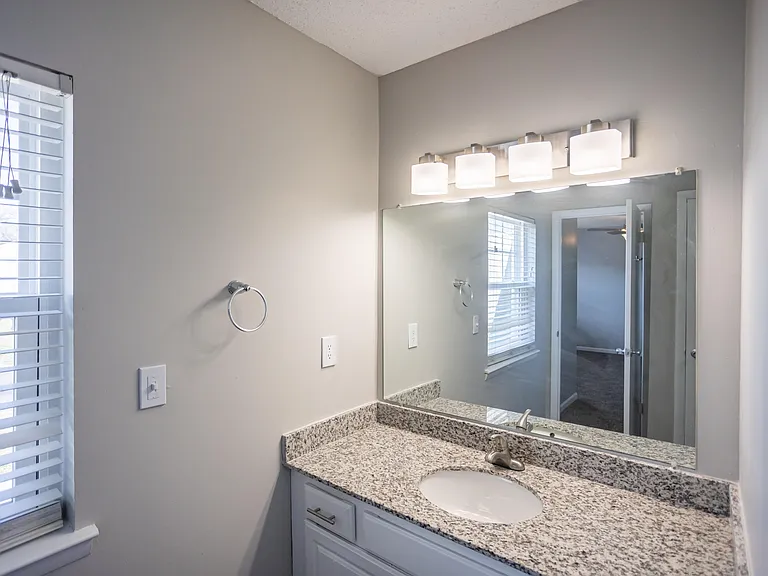 Bright bathroom with granite counters
