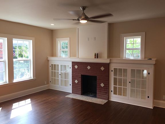 original built in cabinets and decorative fire place