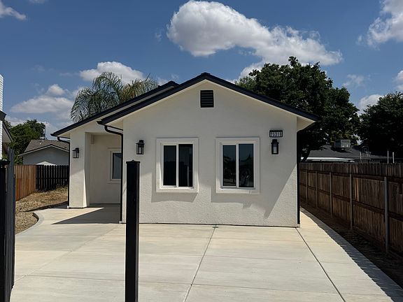 Metal post provides locking mechanism for both entry gated and large swinging drive-way gate.