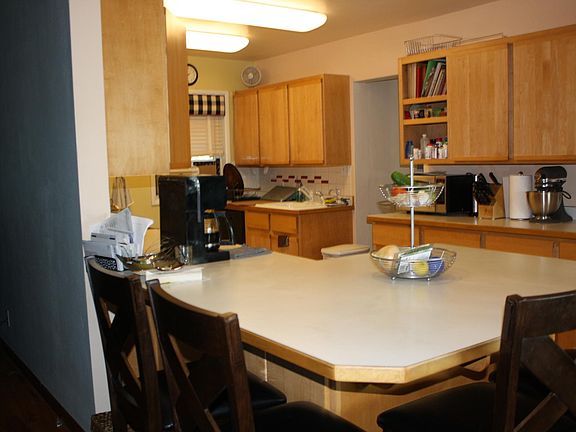 view of kitchen from dining area, with counter seating