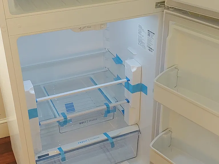 Brand new refrigerator open.
