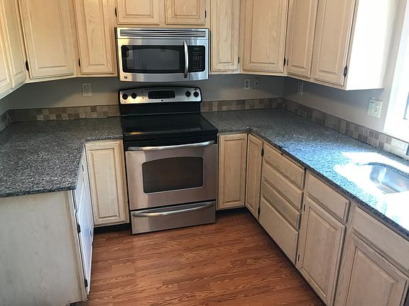 Brand New Granite Counters and Backsplash with Stainless Appliances!