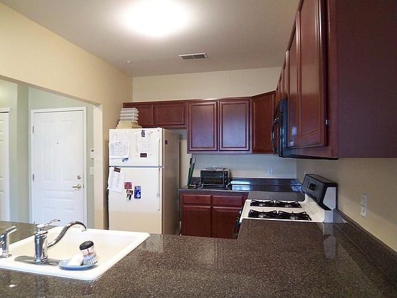 Kitchen with cherry cabinets
