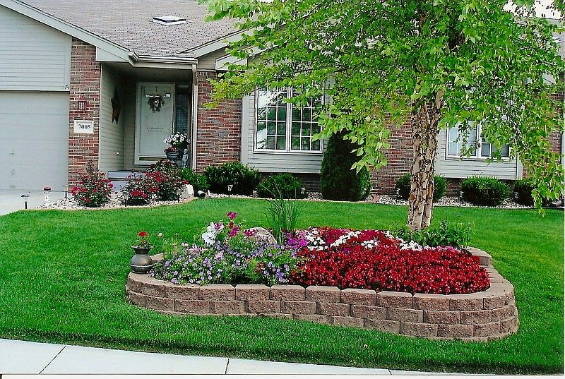 Professionally Planned and Installed
						:
						Foundation Plants; Raised Brick Garden; Roses; Birch Tree; Decorative Lighting