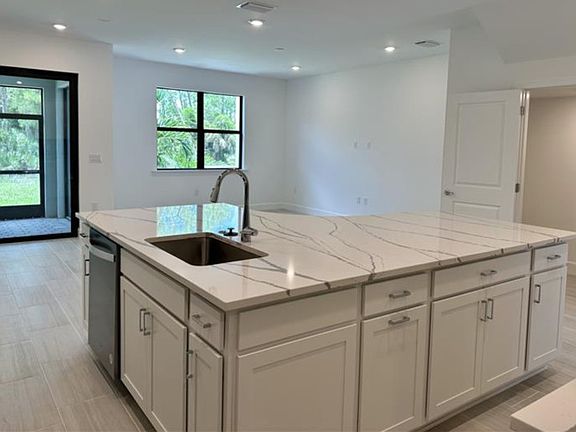 Kitchen overlooking gathering room and lanai