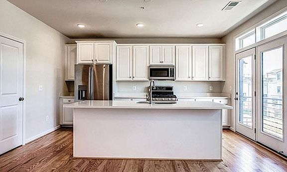 Large island, closet pantry and deck off of kitchen area