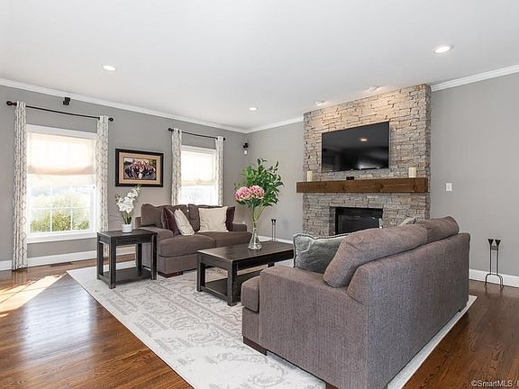 Sophisticated and elegant family room with gas fireplace