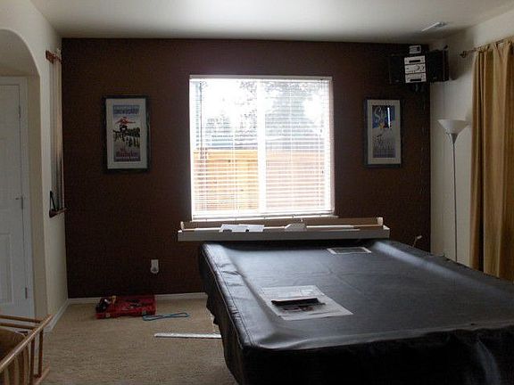 We have added a hanging light above the pool table to polish off this room.