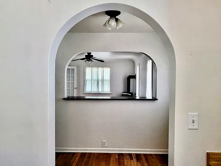 View from kitchen into dining space and further into the living area.