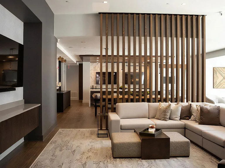 Clubhouse Lounge Featuring Sectional Seating and Decorative Screen