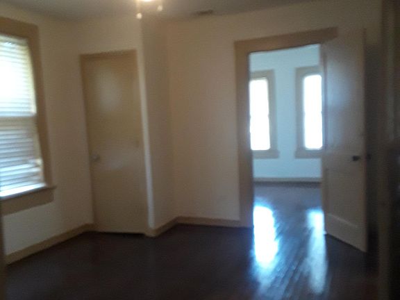 bedroom 1 and two ceiling fans