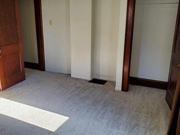 largest bedroom, has full size closet, front window, side window