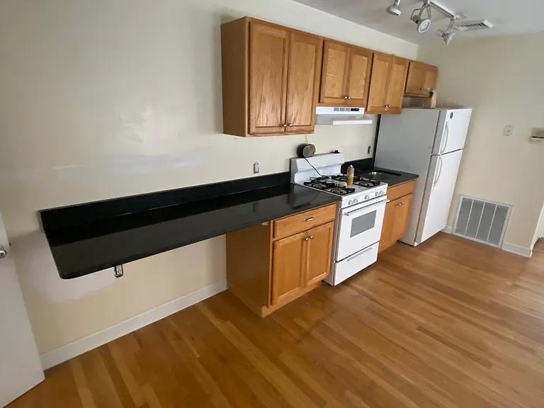 Lots of storage and countertop with granite counters