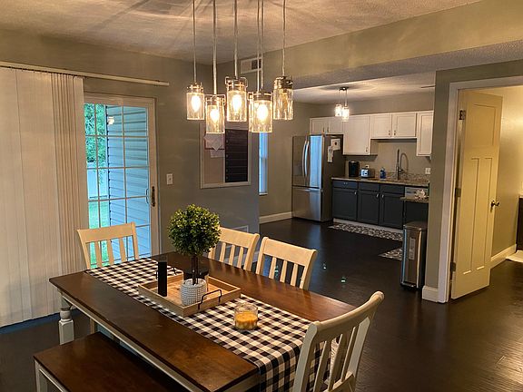 Living area open to kitchen & half bath & back porch