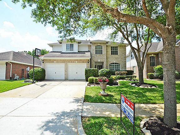 Front elevation,double wide driveway,Lush Landscaping