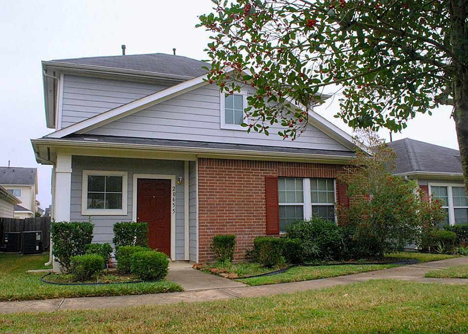 Garage and alley-way with entrance to the house on the back