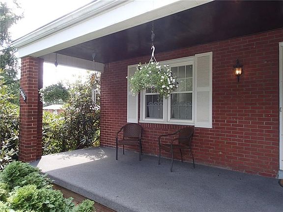 The charming covered front porch offers a tranquil place to sit and relax!