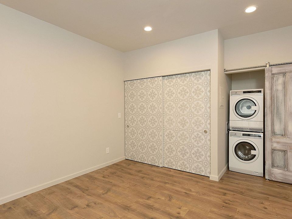 Large bedroom closet and laundry in closet