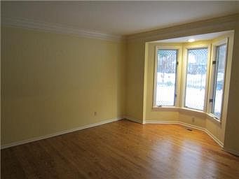 Formal living room with bay window.