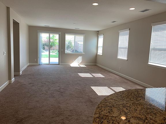family room off of kitchen. does have a ceiling fan and light