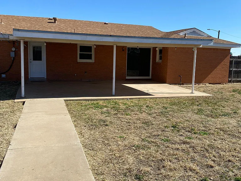 View towards back door and large covered patio area.