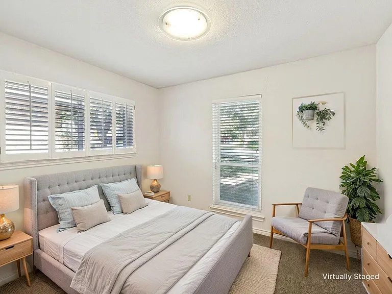 Bedroom 3 is in the corner front of the home with lots of natural light, a walk in closet, and window covering to ensure a restful sleep.