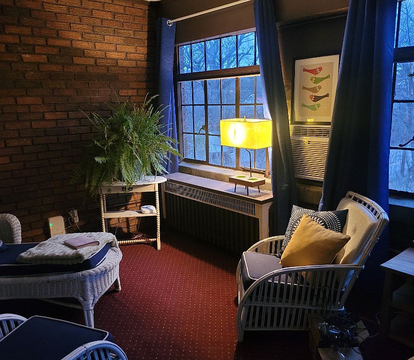 Large, cozy sunroom for morning coffee or convenient home office.