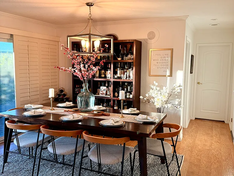 Dining room with sliding door to covered patio and garden.