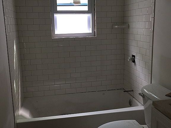 New tile bathrooms