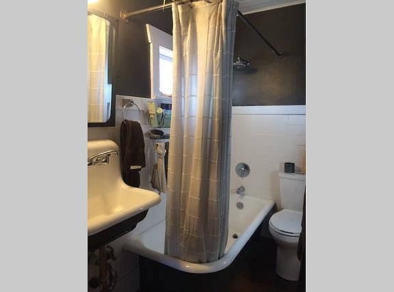 our newly glossed vintage tub and sink and painted bathroom