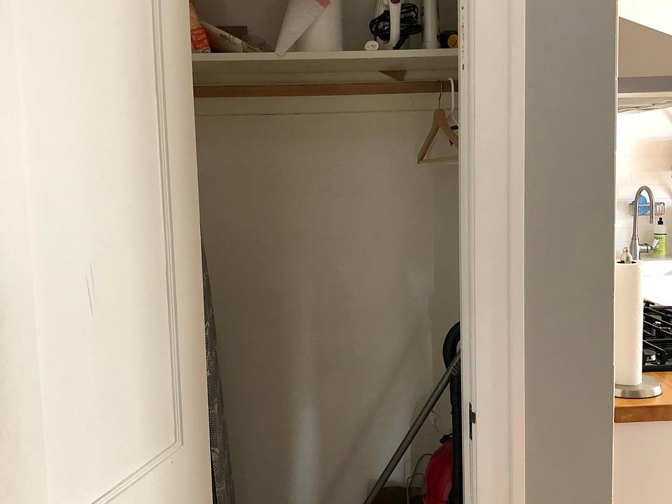 Closet off of the kitchen, directly by the back door. Can be used as a coat closet or a very spacious pantry.