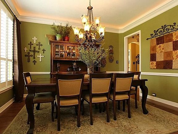 Formal Dining features Hardwood Floors and Plantation Shutters