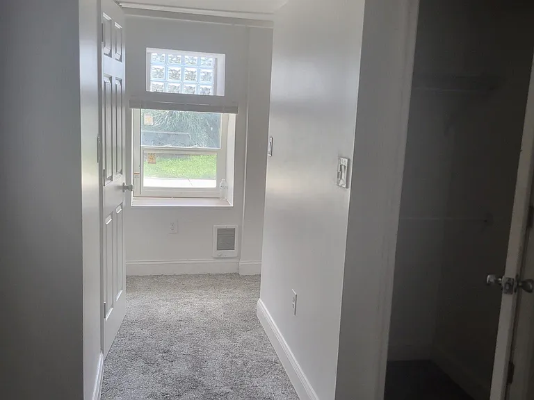 standing in bedroom looking out to the hallway