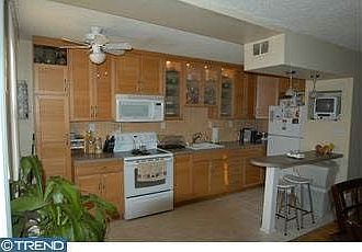 Gorgeous updated kitchen, breakfast bar, tiled ceramic floor and back splash.