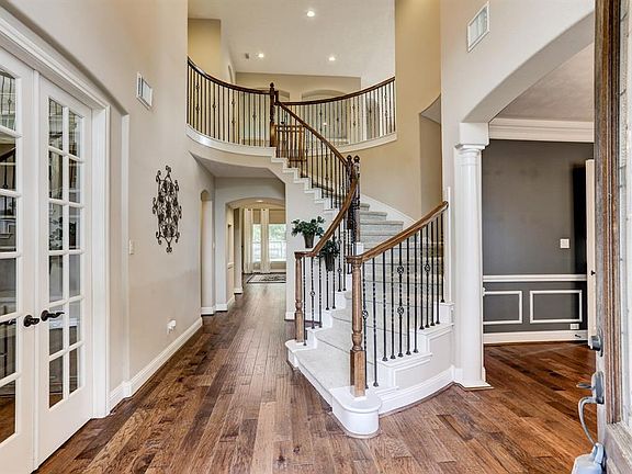 Inviting two story entry with gleaming hardwood floors throughout the whole living space starting here.