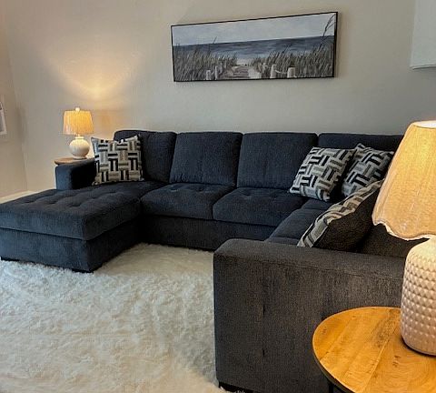 All Brand sectional couch and sleeper pulls out in the middle with a storage section.