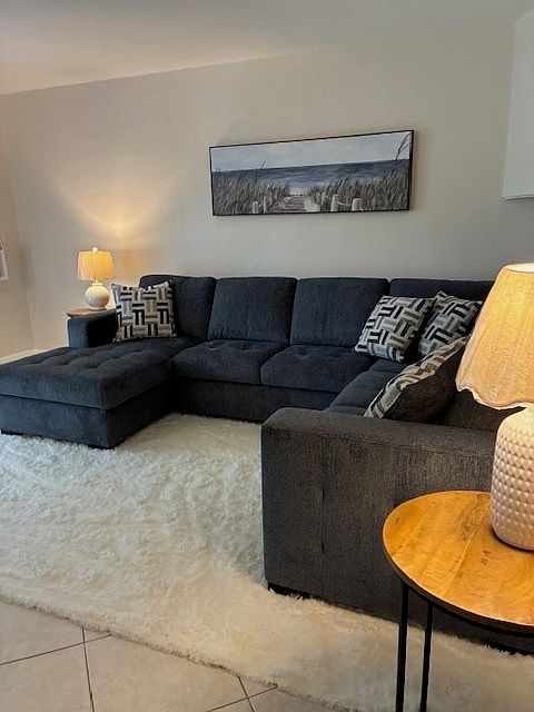 All Brand sectional couch and sleeper pulls out in the middle with a storage section.