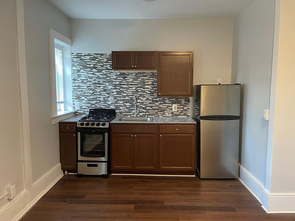 Newly renovated kitchen with granite countertops and stainless steel appliances