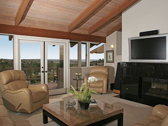 Ocean view living room with double sided fireplace