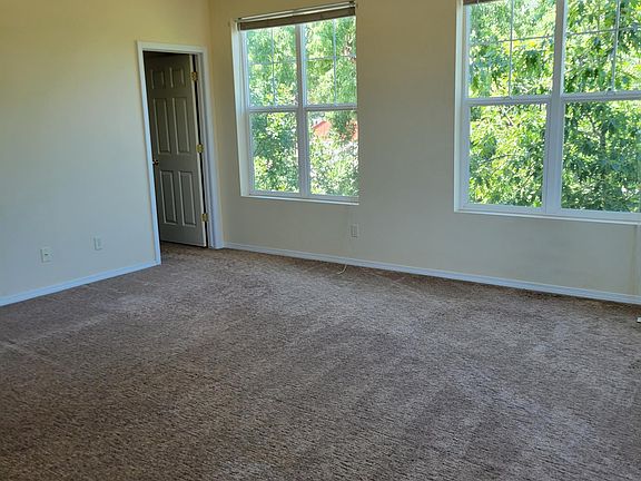 Master bedroom windows facing north, entry door to master bath