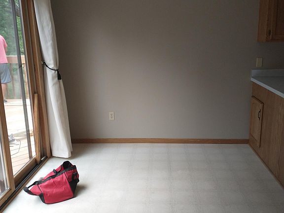 Dining room with between kitchen and living room, with access to back deck.