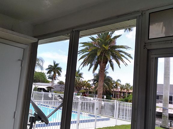 View of the pool and the canal from your lanai