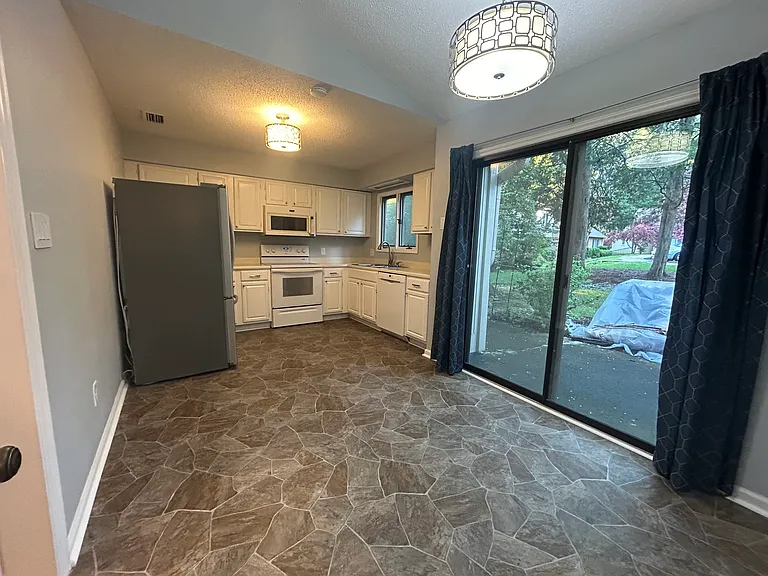 Kitchen, sliding doors go out to patio. Plenty of room for dining table.