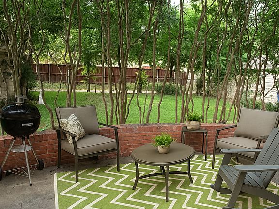 Large elevated porch in fenced back yard