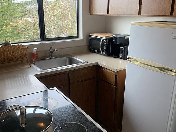 Kitchen has a microwave, stove, fridge, and a coffee pot (if rented furnished).