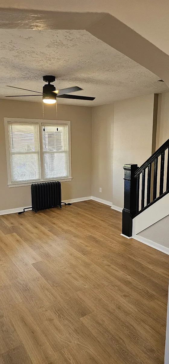 Living room with new paint and New vinyl flooring - 1300 Maryland Ave #HALF