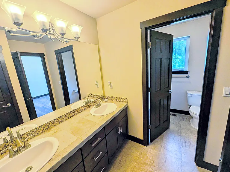Toilet and Shower room with its own door enables Jack-n-Jill and the toilets to be used together.