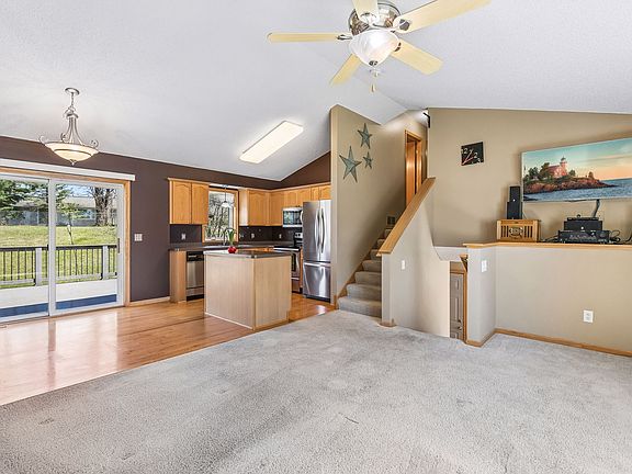 Open concept combines living room, dining room, and kitchen.
