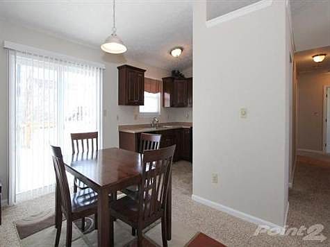 Newer sliding glass door to the deck from open and inviting dining area.